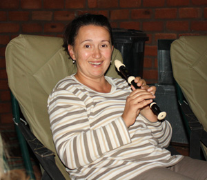 Andrea playing flute Kalahari family hunt, Namibia