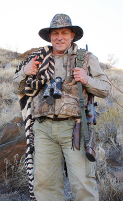 Victor carrying his Zebraskin after it was slaughtered on the mountain Hartmann's Zebra Hunt Namibia