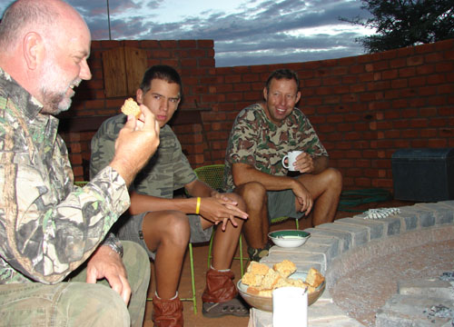 The hunters having rusks before starting their hunt Kalahari Hunt Namibia