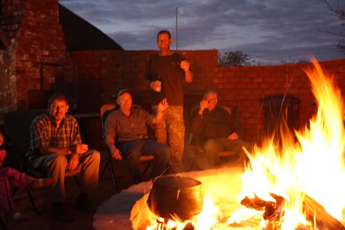 Around the fire with prof Gritters and prof Dykstra from Michigan, USA