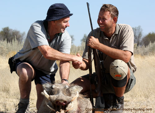 Tom and Michael sharing a special moment after the Warthog hunt Namibia Warthog Hunt